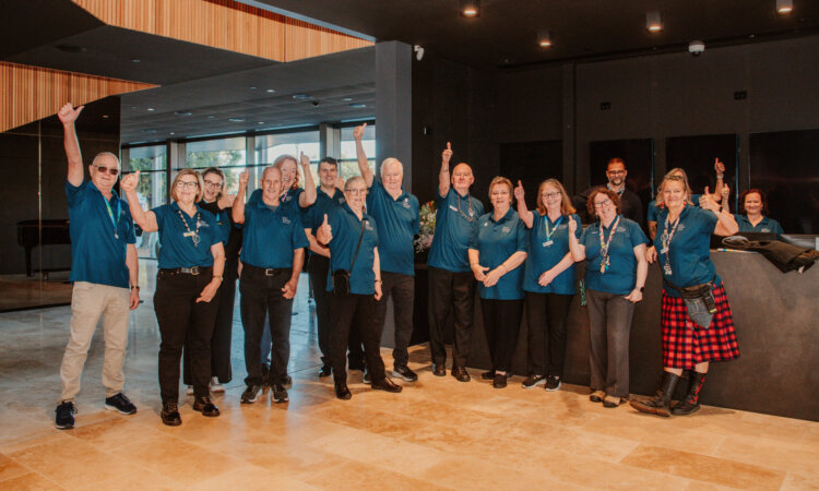 Group photo of volunteers in the foyer of the Saltwater building.